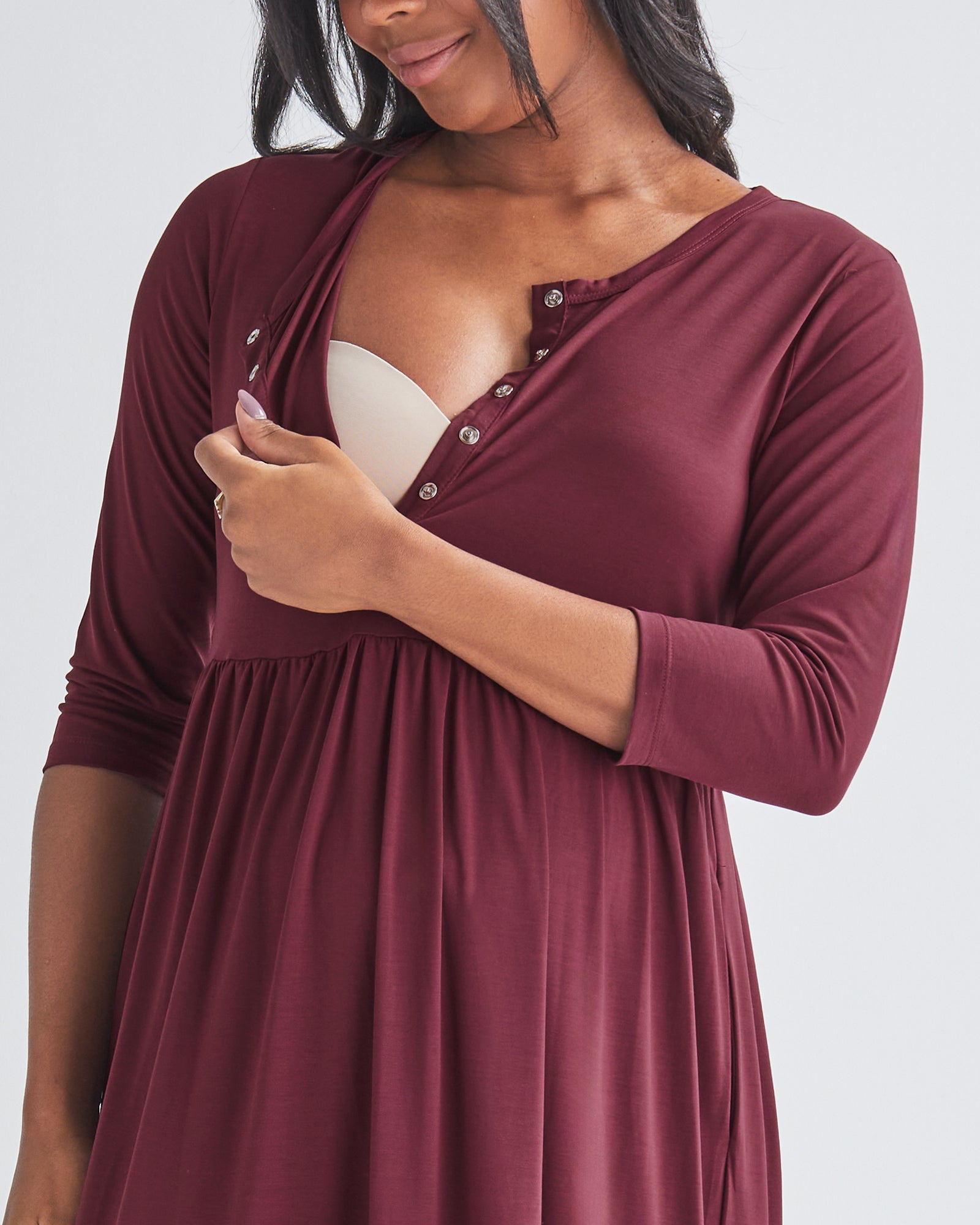 Breastfeeding Access - A Pregnannt Woman Wearing Tiered Maternity Midi Dress in Burgundy from Angel Maternity Showing Easy Access to Breastfeeding.
