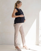 lady is wearing black maternity shirt with beige colour maternity straight pant