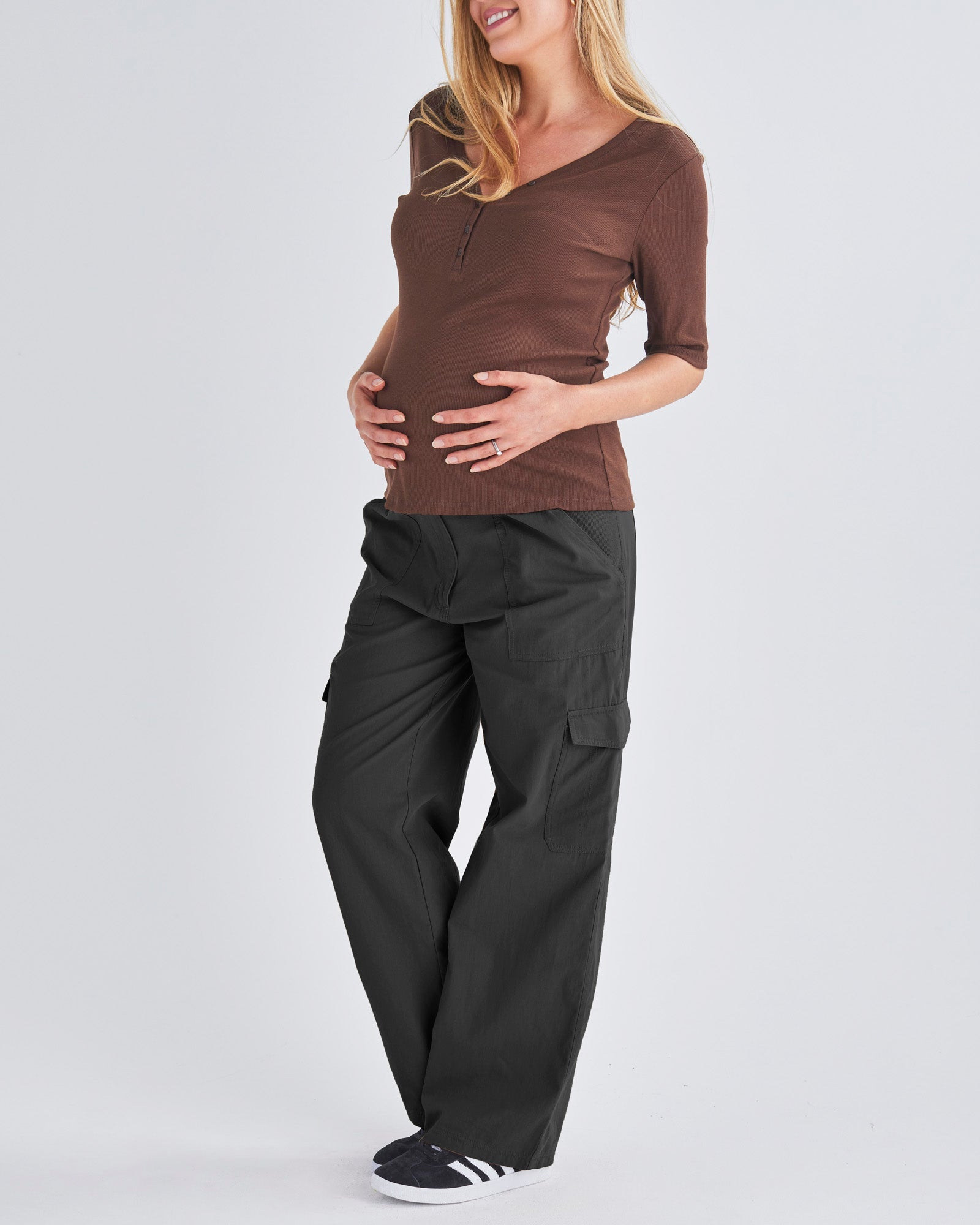 A Pregnant Woman Wearing Black Maternity Cotton Cargo Pants from Angel Maternity