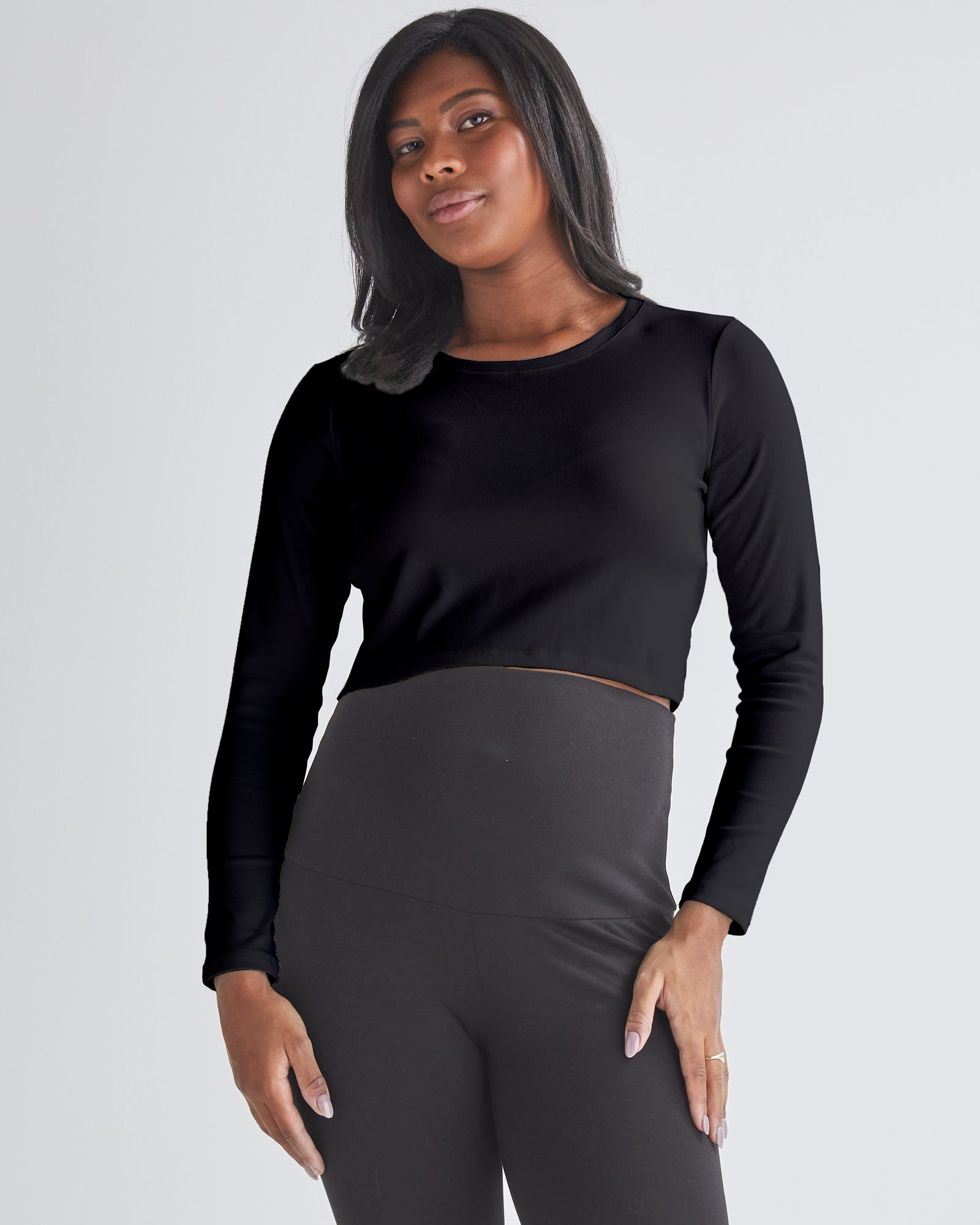 Front View - A Pregnant Woman Wearing Long Sleeve Cotton Black Maternity Crop Top from Angel Maternity