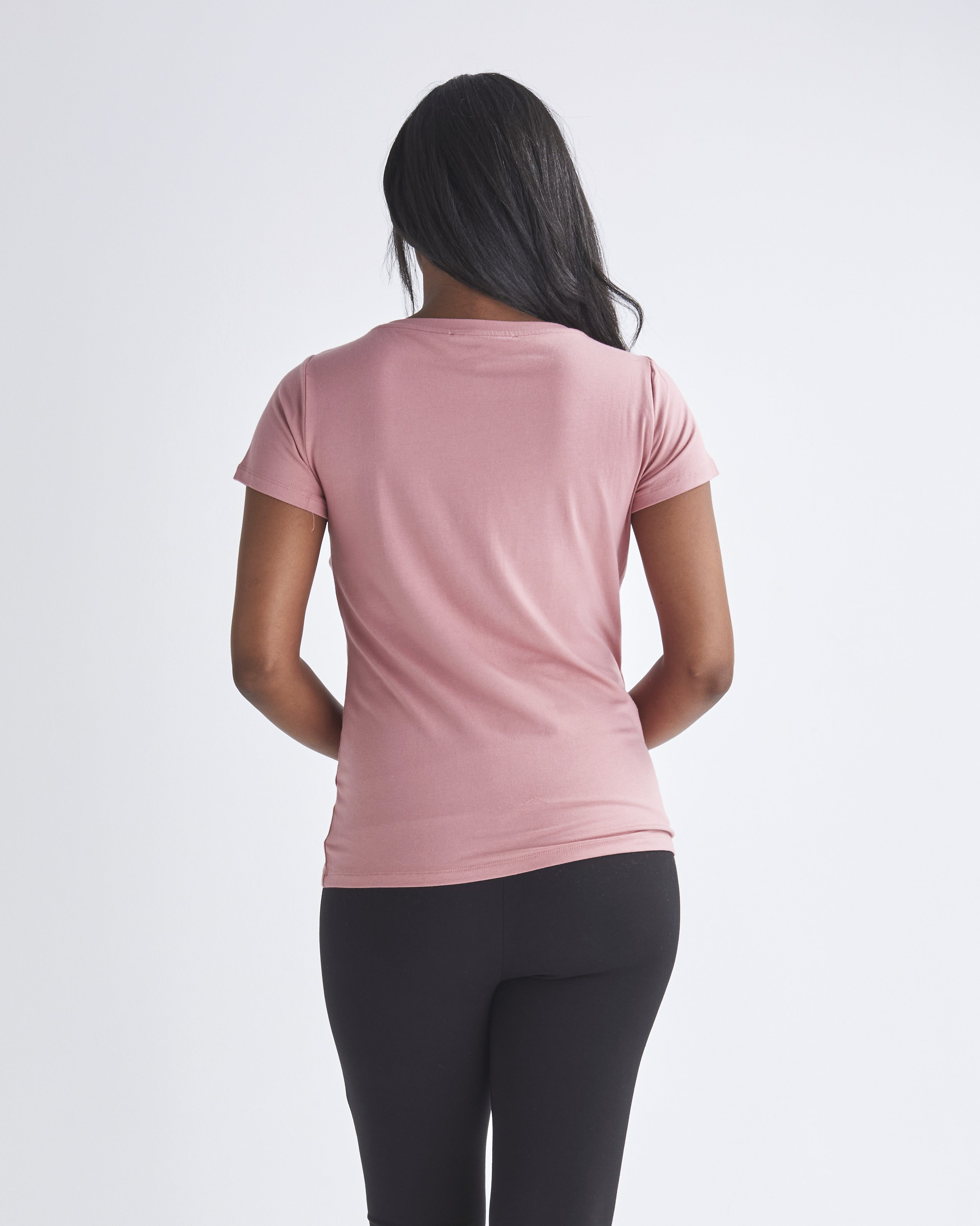 Back view - A woman wearing easy access to breastfeeding nursing top with petal front design from Angel Maternity