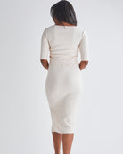Back View - A Pregnant Woman Wearing Athena Maternity Pencil Midi Skirt in Oat Milk from Angel Maternity