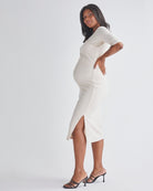 Side View - A Pregnant Woman Wearing Maternity Cross Over Off Shoulder Top in Cream from Angel Maternity