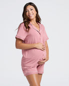 Woman wearing a pink bamboo maternity pajama setbackground