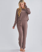 A pregnant Woman Wearing 2-piece Maternity Winter Lounge Set (long sleeve crop top & pants) &  in Mocha from Angel Maternity