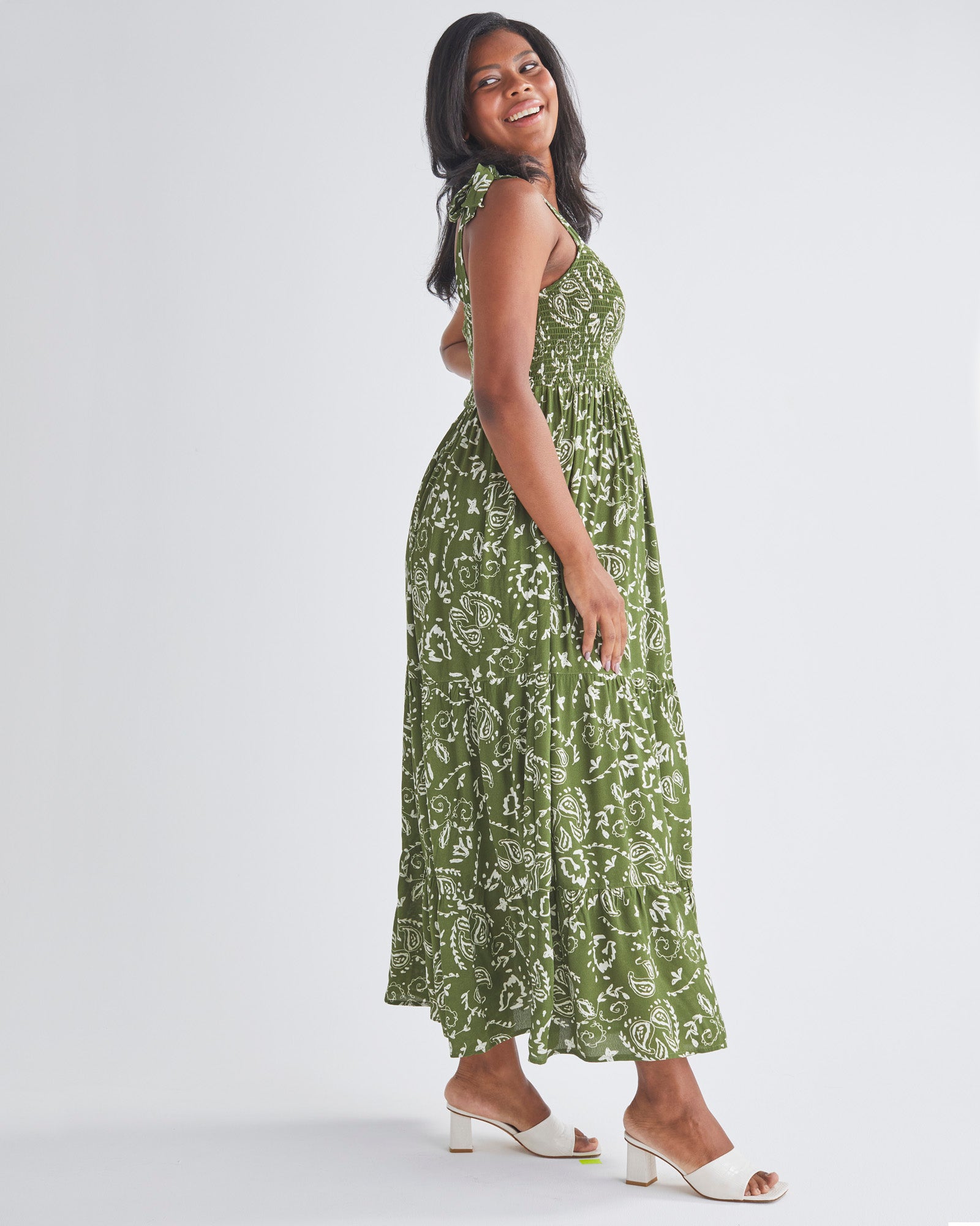 Side View - A Pregnant Woman Wearing Lilliana Maternity Green Dress in Paisley Print from Angel Maternity
