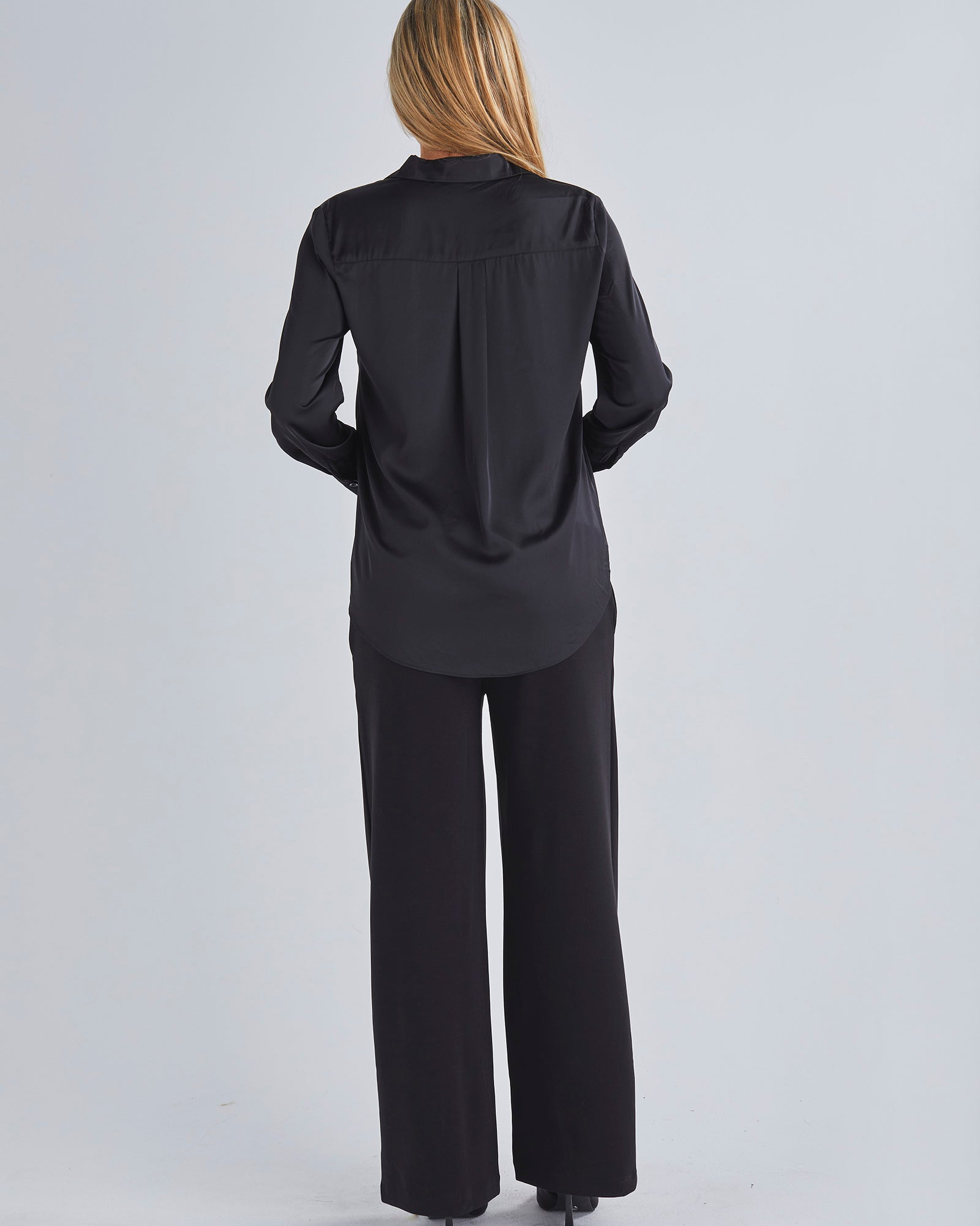 Back view-This maternity work shirt has long sleeves with a button up cuff which you can dress it up or down, this versatile piece offers comfort and sophistication for any occasio from Angel Maternity