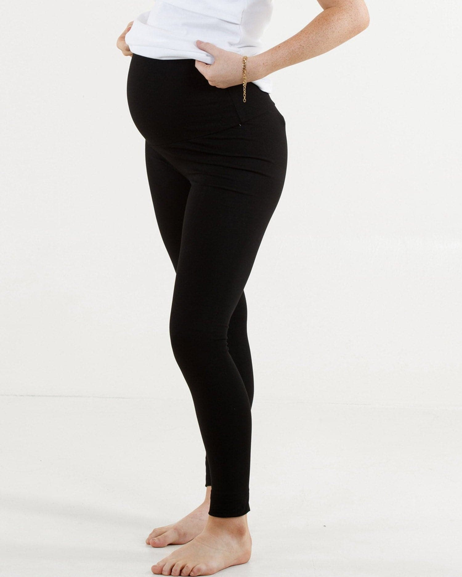 A woman in black maternity basic cotton legging, side (4429501005927)