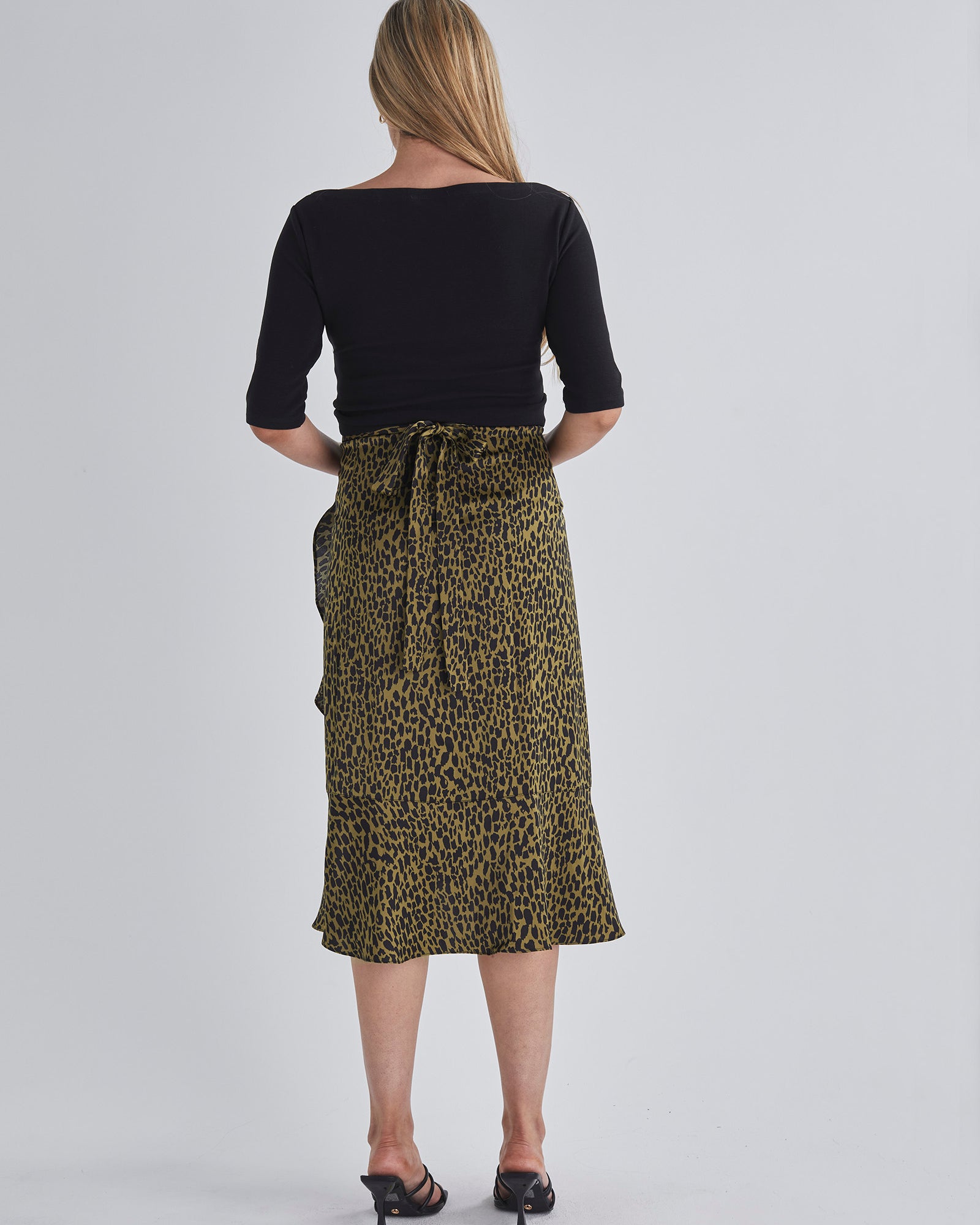 Back view-Throw on and go Midi skirt Designed to fit through all stages of pregnancy Wrap design Ruffled hem from AngelMaternity