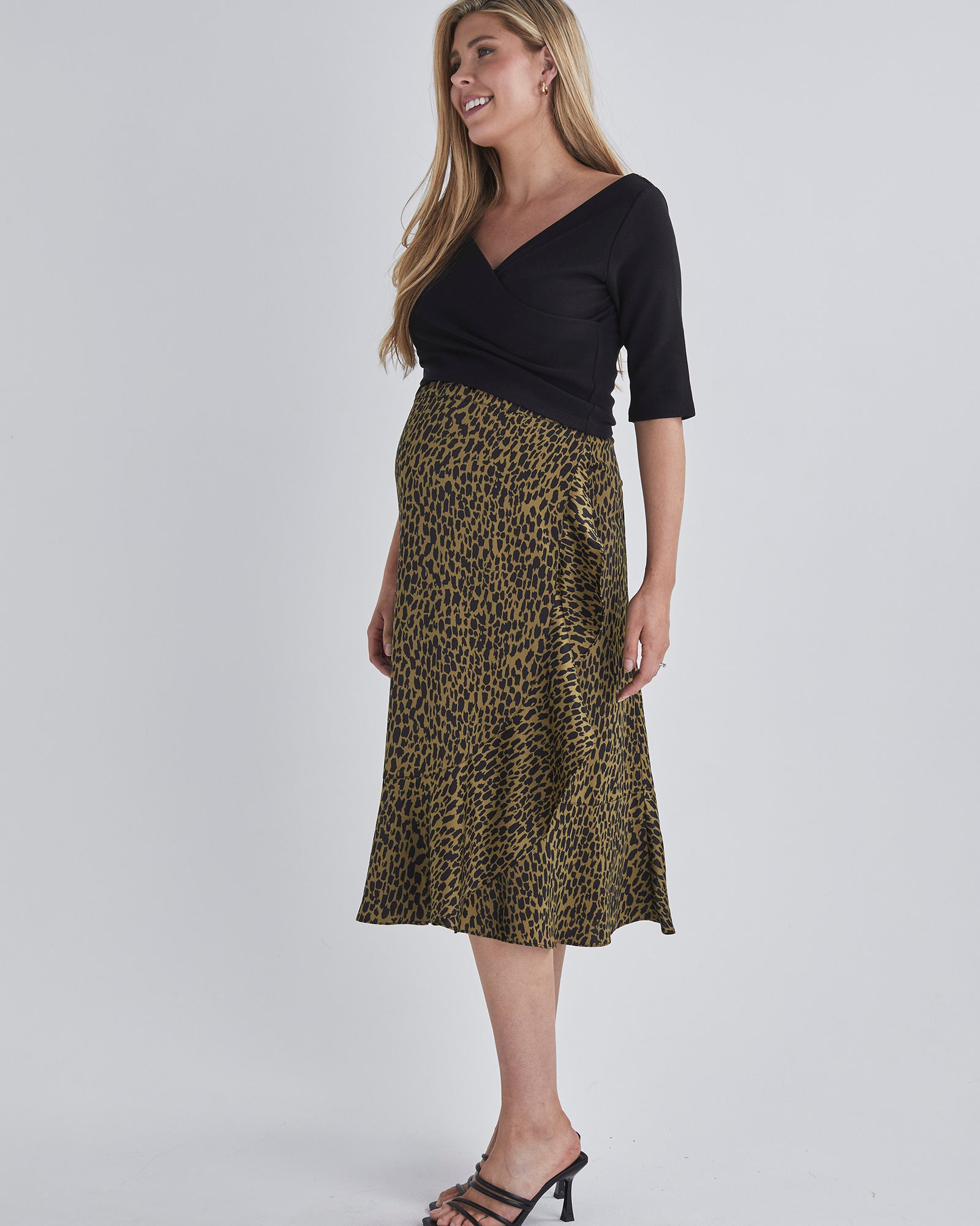 Side view-Throw on and go Midi skirt Designed to fit through all stages of pregnancy Wrap design Ruffled hem from AngelMaternity