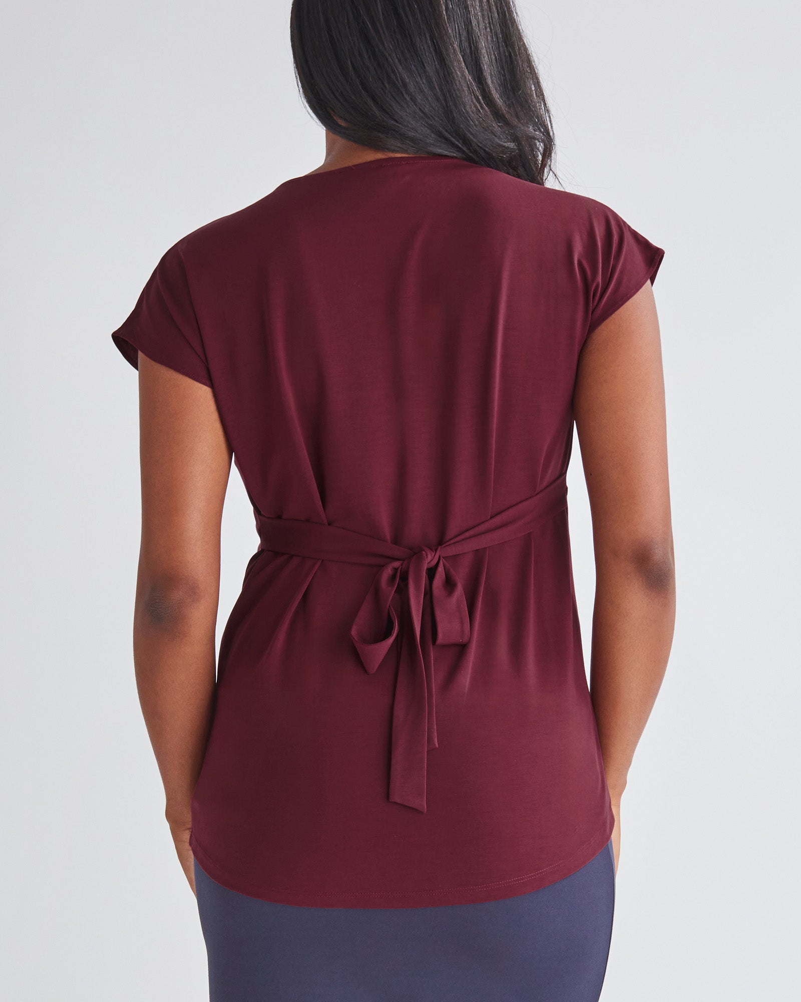 Back View - A Pregnannt Woman Wearing Maternity Crossover Burgundy Work Top in from Angel Maternity.
