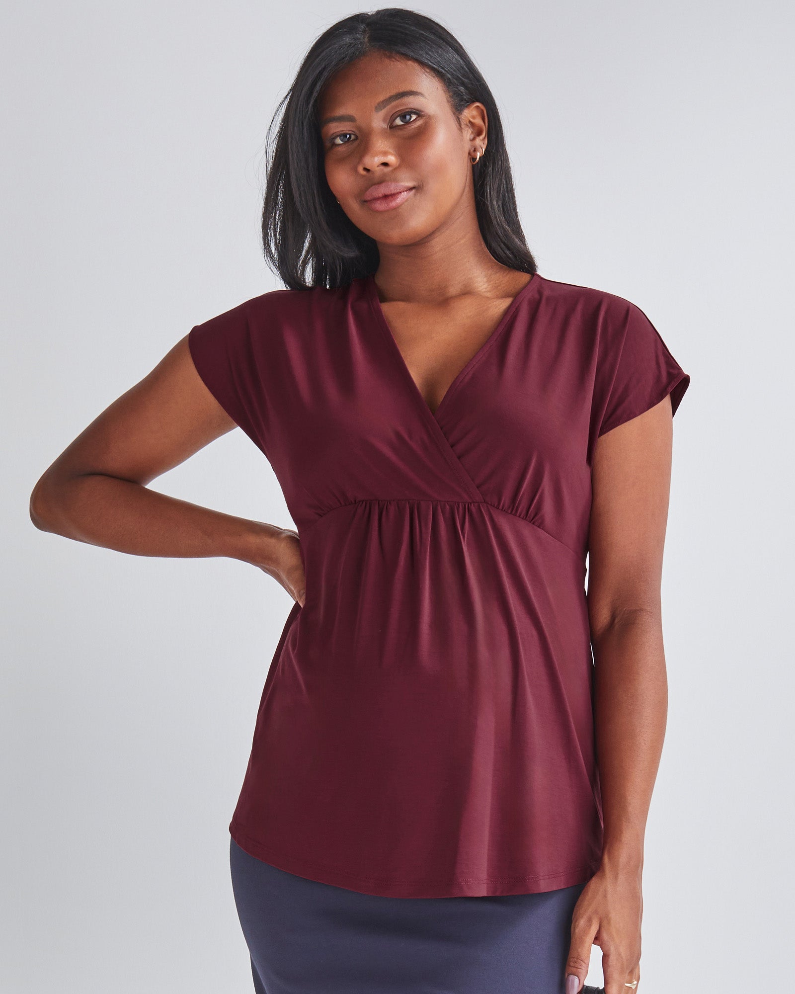 Main View - A Pregnannt Woman Wearing Maternity Crossover Burgundy Work Top in from Angel Maternity.