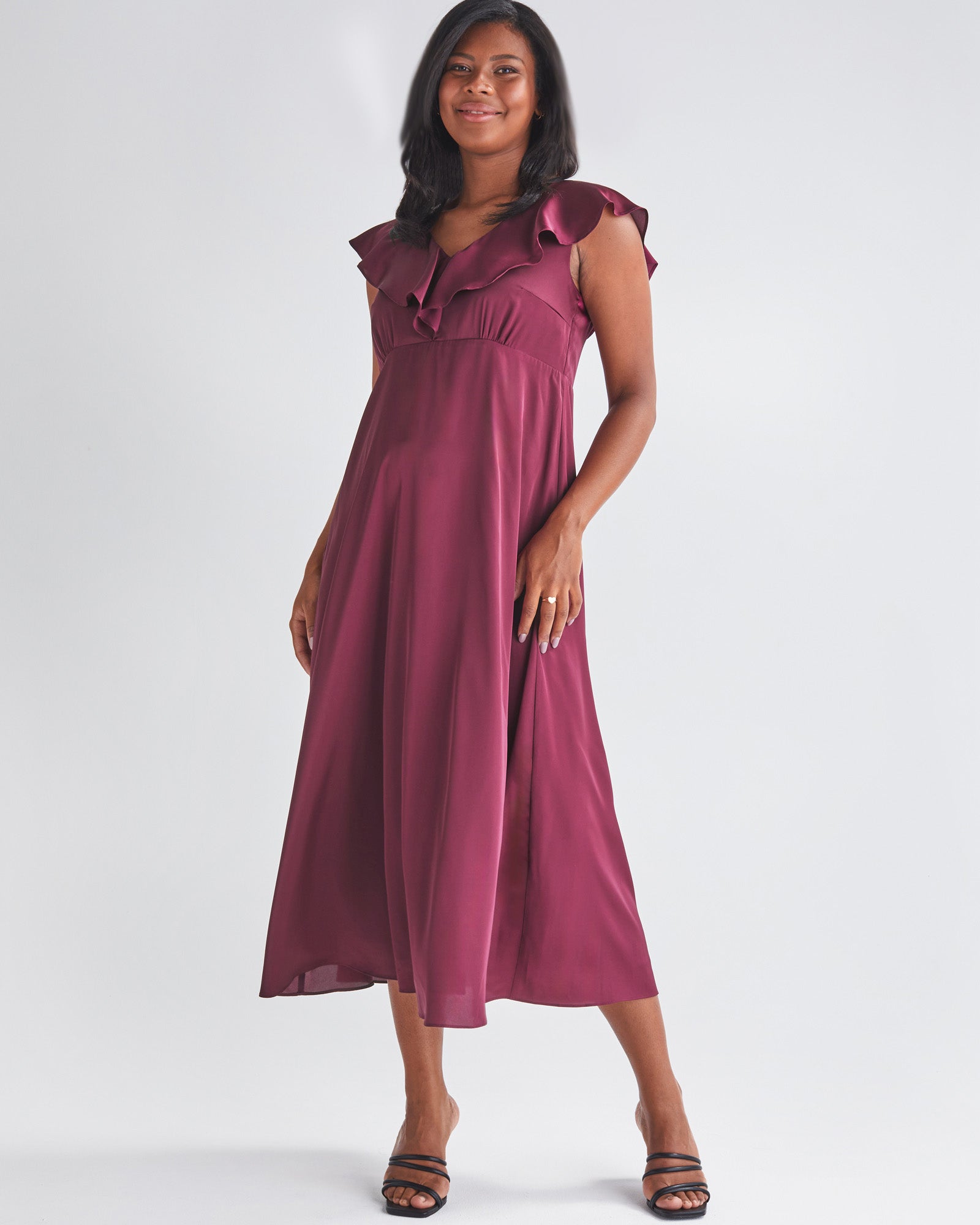 Front View - A Pregnannt Woman Wearing Mika Maternity Evening Ruffle Dress in Wine from Angel Maternity.