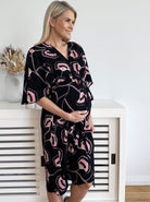 Main View - Maternity Bella Black Midi Dress in Hibiscus Print in Angel Maternity