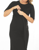 A woman in black angel maternity annabella knit dress, feed (6594399666279)