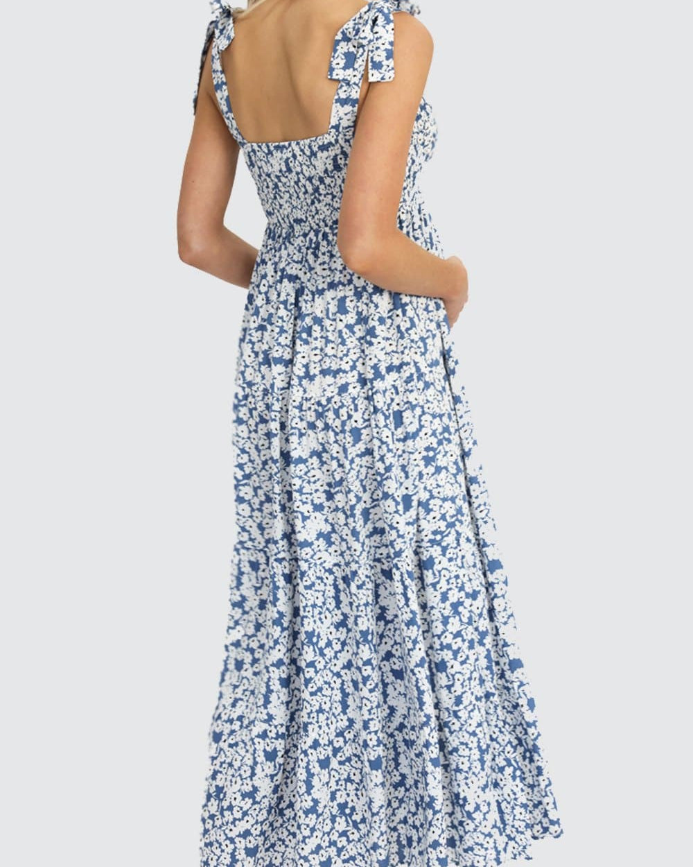 Back View - A pregnant Woman in Nursing Friendly Shoulder Tie Maternity Maxi Dress in Blue Print
