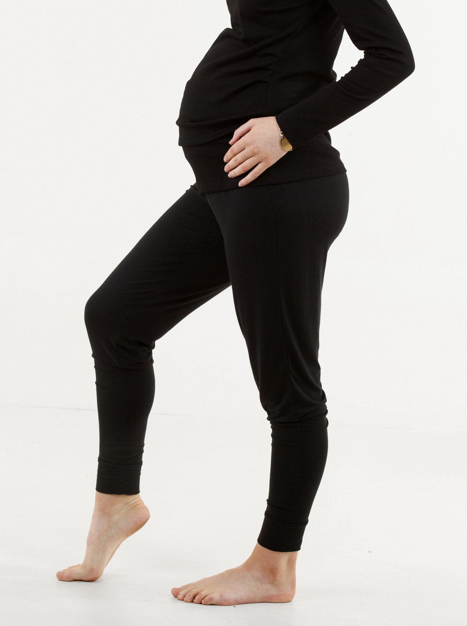 A woman in black bamboo maternity lounge pants, side (189033512981)