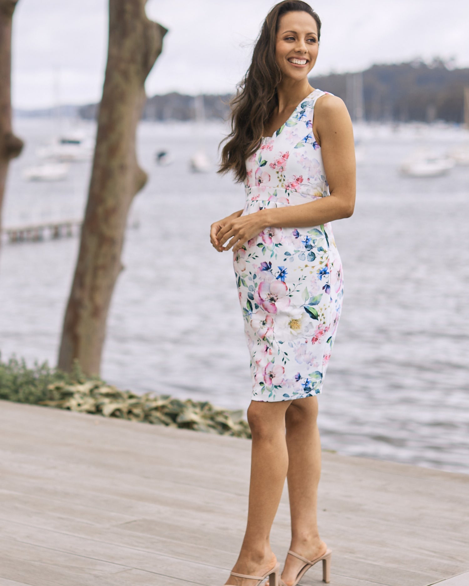 Main View - A Pregnant Woman in Floral Maternity Dress. Floral Print in White Colour