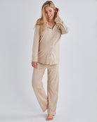 Main view-A pregnant woman wearing button front nursing freindly pyjama set in pink from Angel Maternity.