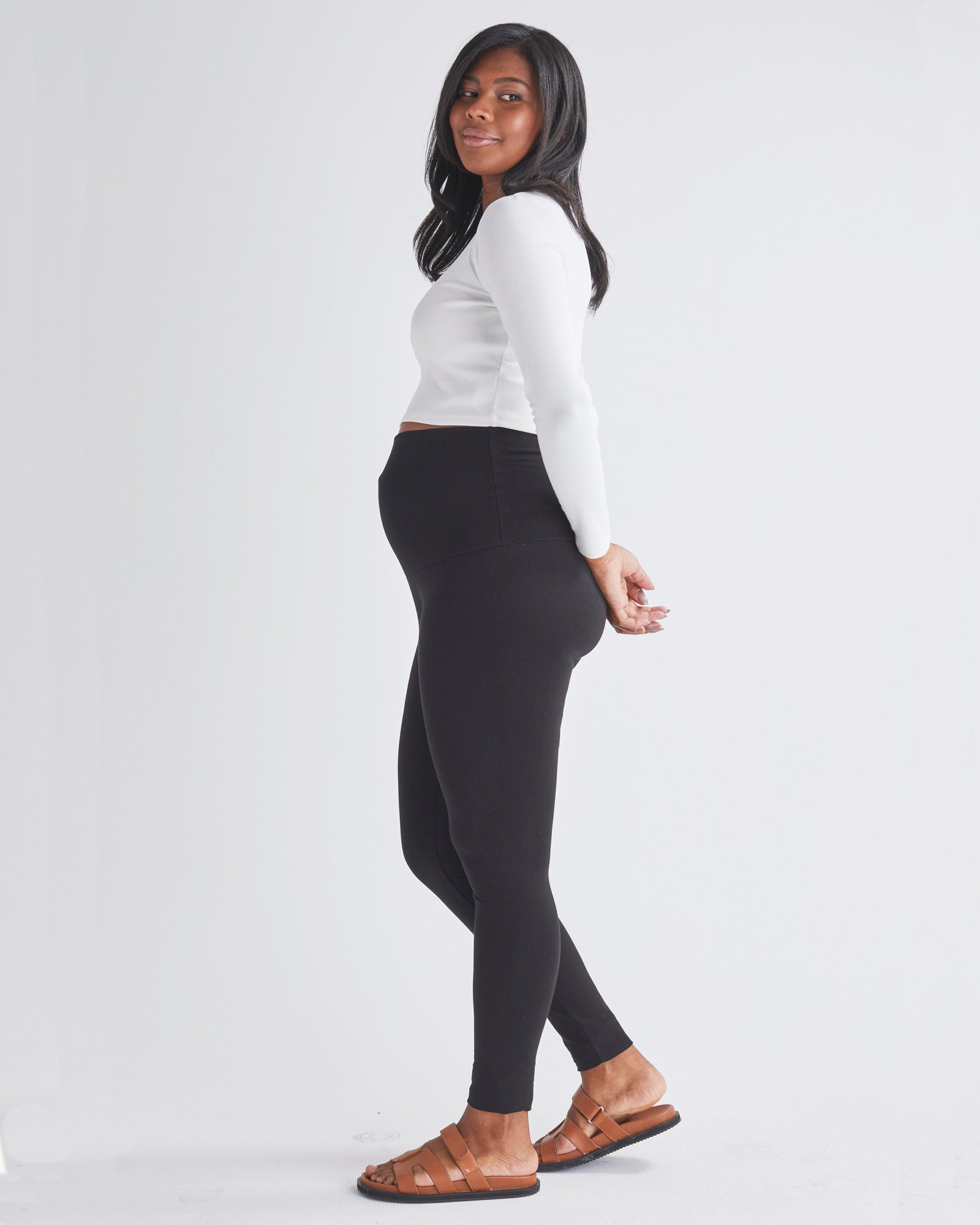 Side View - A Pregnant Woman Wearing Maternity Long Sleeve Cotton Crop Tee in White from Angel Maternity