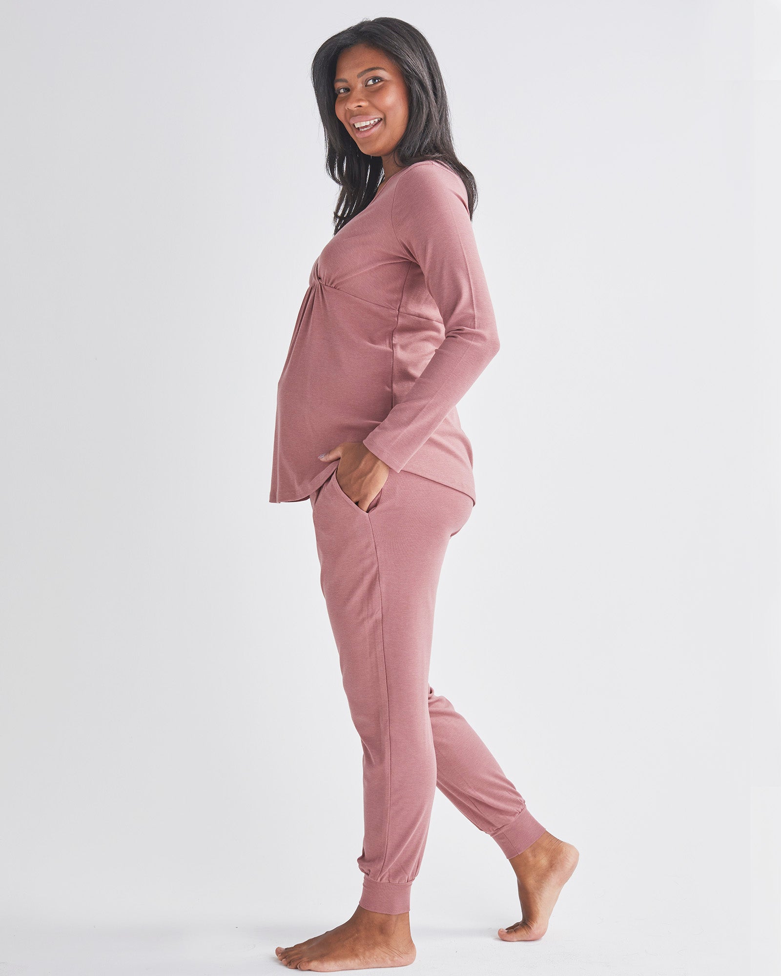 Side View - A Pregnant Woman Wearing 2-Piece Kyra Maternity Loungewear/Sleepwear PJ set in Pink from Angel maternity