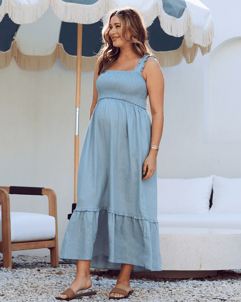 Side view - Maternity shirred dress in light blue
