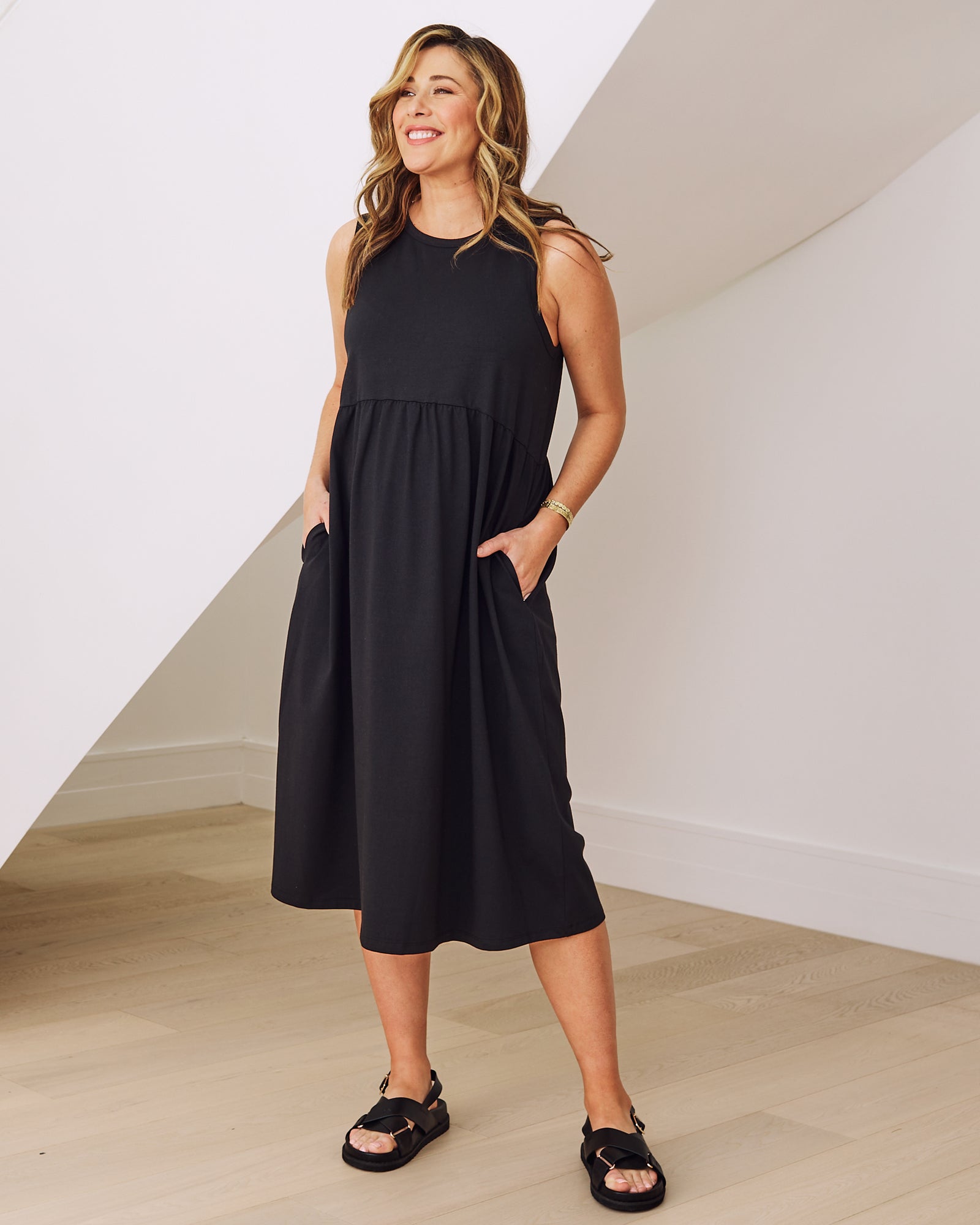 Side view- maternity  relaxed fit cotton dress in Black