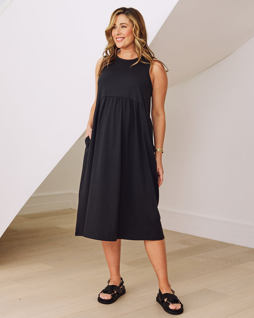 Front view- maternity  relaxed fit cotton dress in black