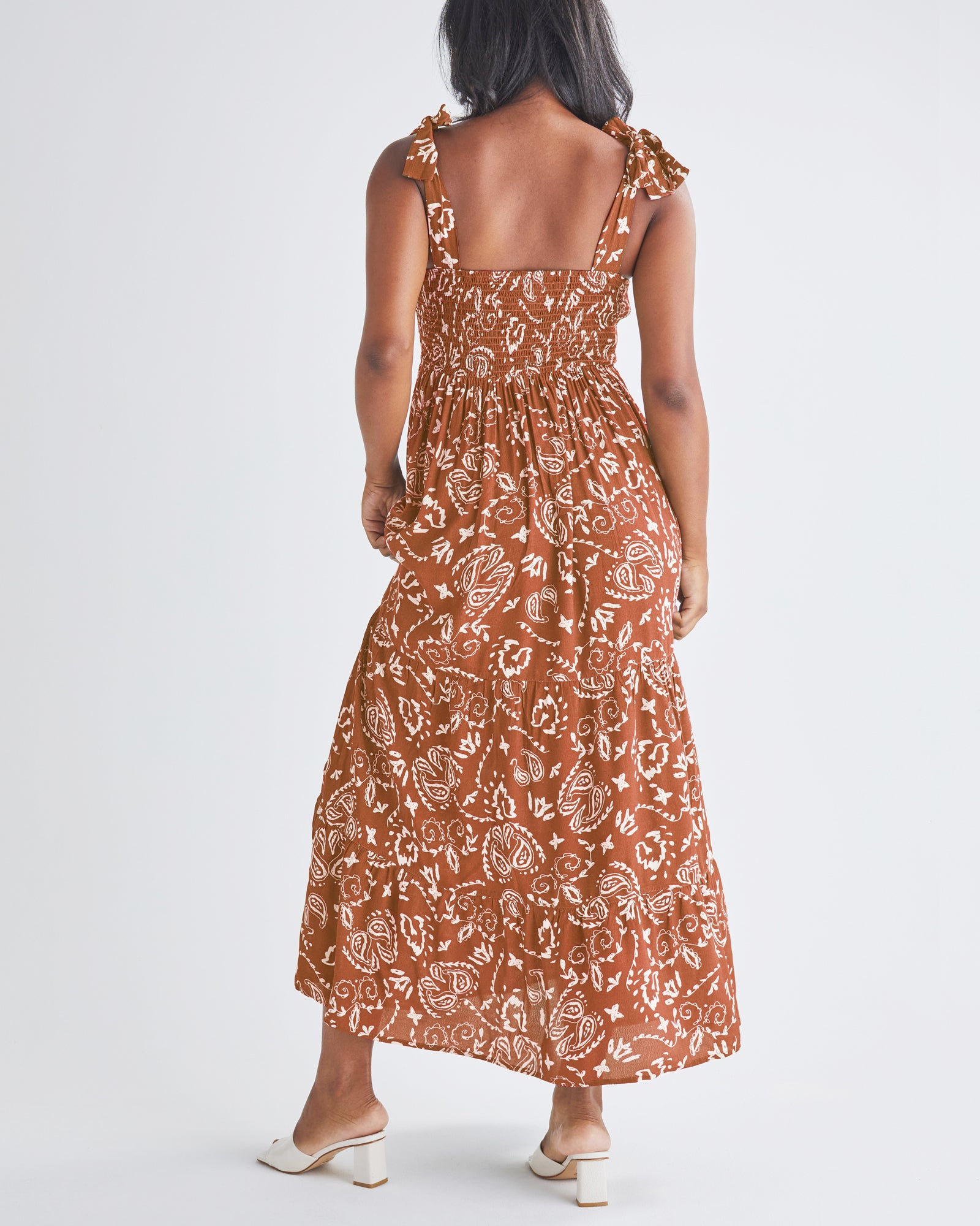 Back View - A pregnant Woman Wearing Maternity Maxi Dress in Brown Paisley Print from Angel Maternity