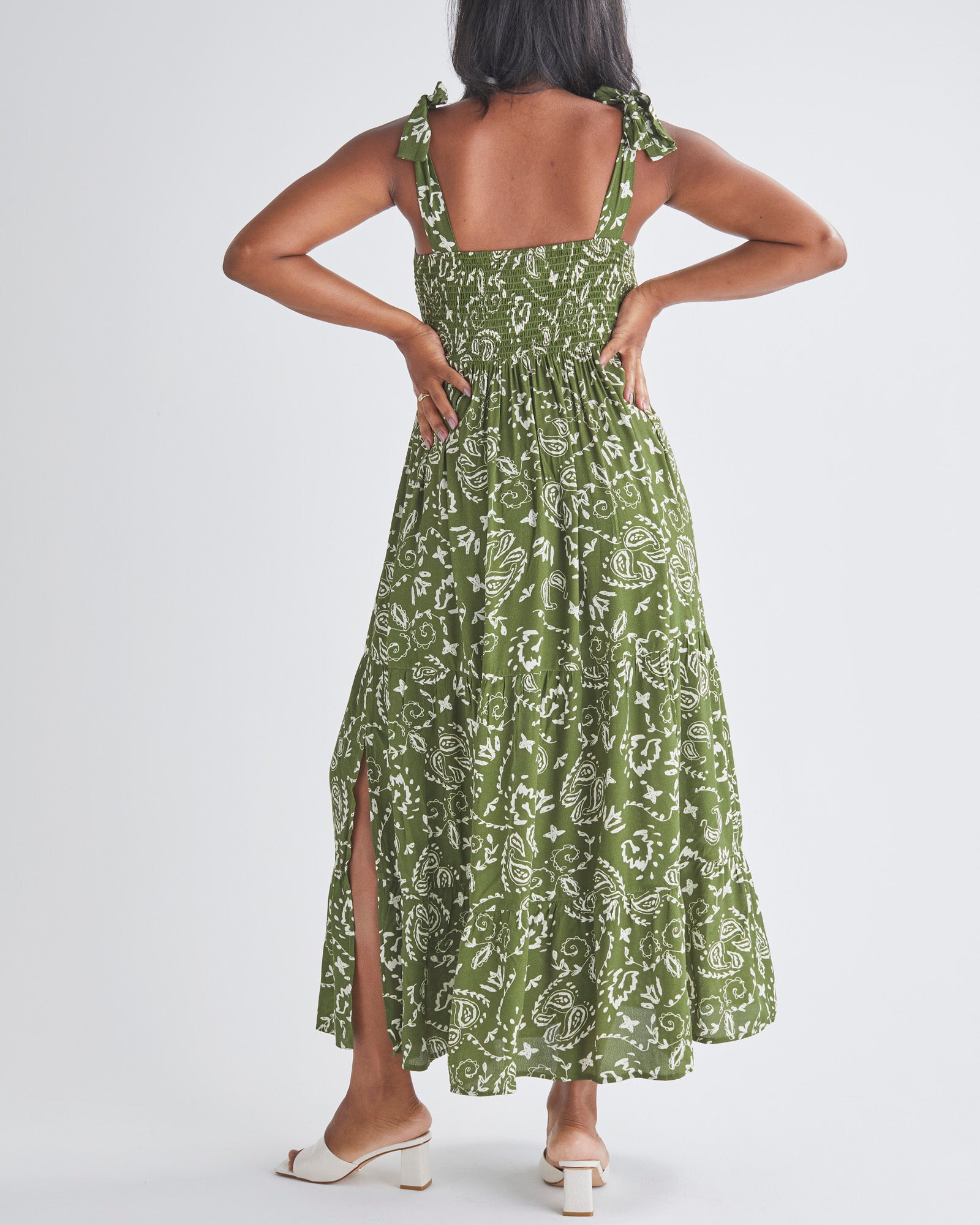 Back View - A Pregnant Woman Wearing Lilliana Maternity Green Dress in Paisley Print from Angel Maternity