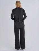 Back view-This maternity work shirt has long sleeves with a button up cuff which you can dress it up or down, this versatile piece offers comfort and sophistication for any occasio from Angel Maternity