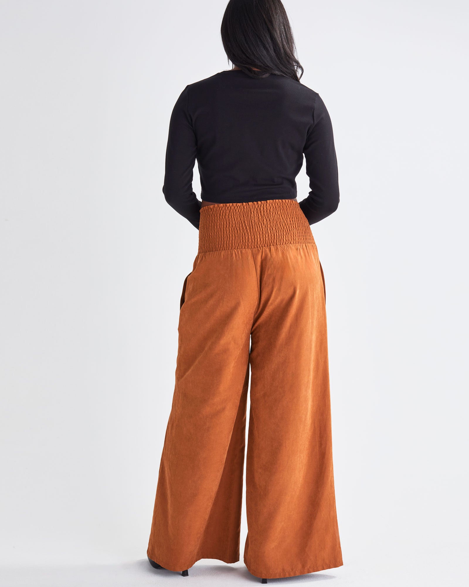 Back View - A Pregnant Woman Wearing Wide Leg Maternity Pants in Brown from Angel Maternity