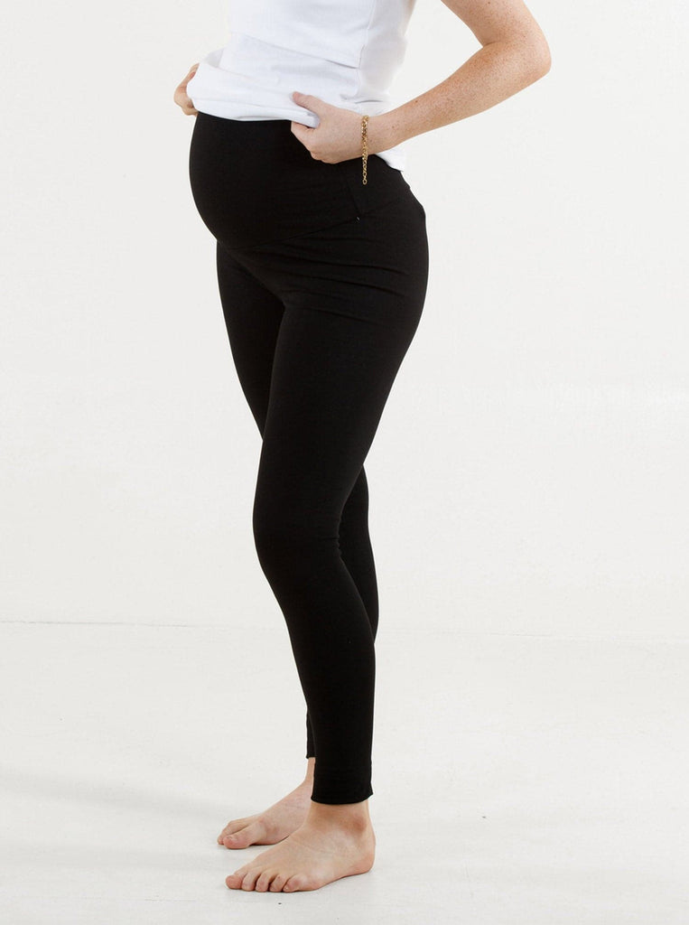A woman in black maternity basic cotton legging, side (4429501005927)