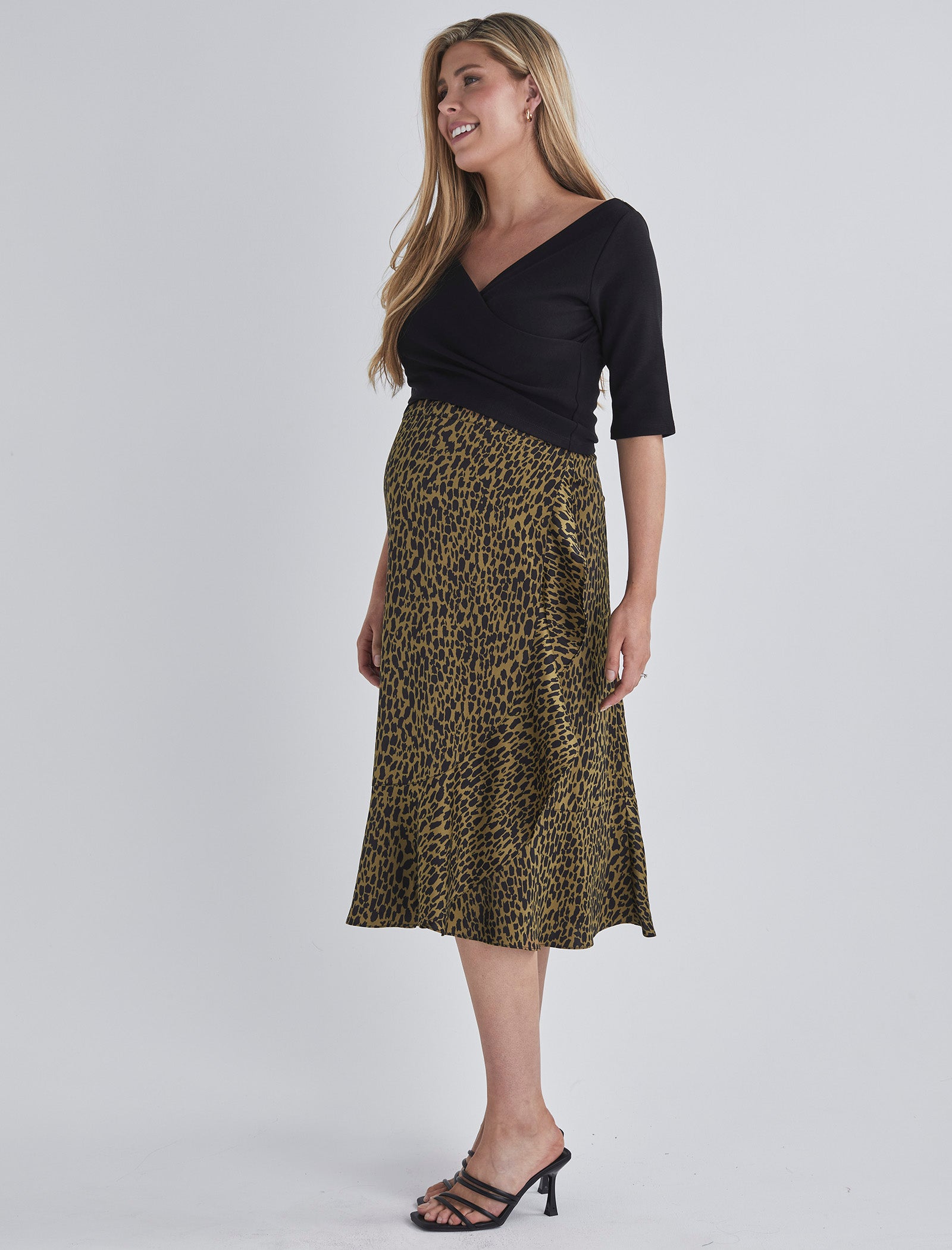 Side view-Throw on and go Midi skirt Designed to fit through all stages of pregnancy Wrap design Ruffled hem from AngelMaternity