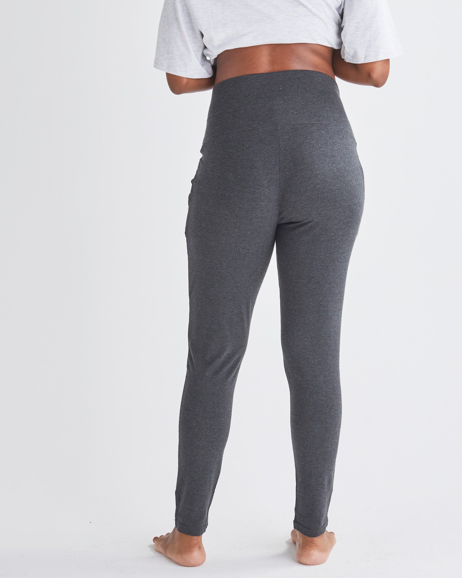 Back View - A Pregnannt Woman Wearing Eden Ultra Soft Maternity Lounge Pants in Charcoal from Angel Maternity.