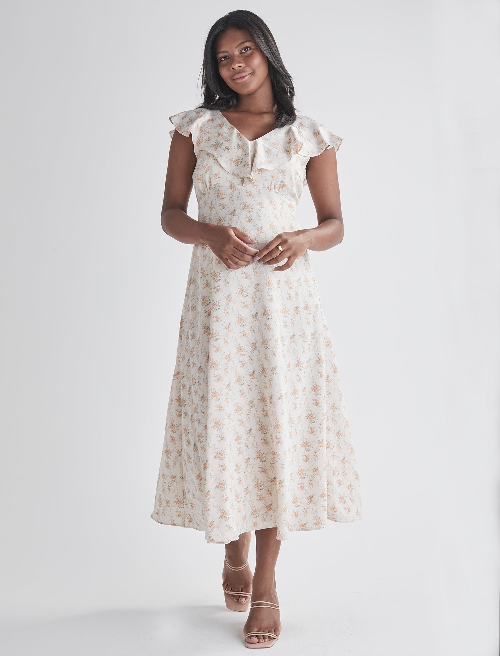 Front view-Delicate ruffle detail at neckline - Smocked, stretch back for comfort - Midi length A-line - Lined top fron Angel Maternity