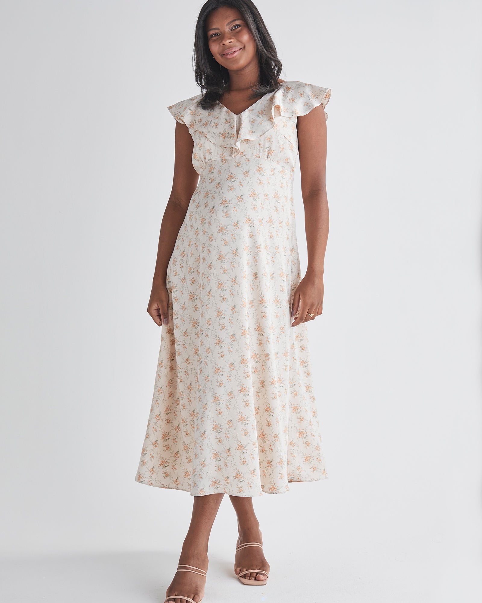 Main view-Delicate ruffle detail at neckline  - Smocked, stretch back for comfort  - Midi length A-line - Lined top fron Angel Maternity