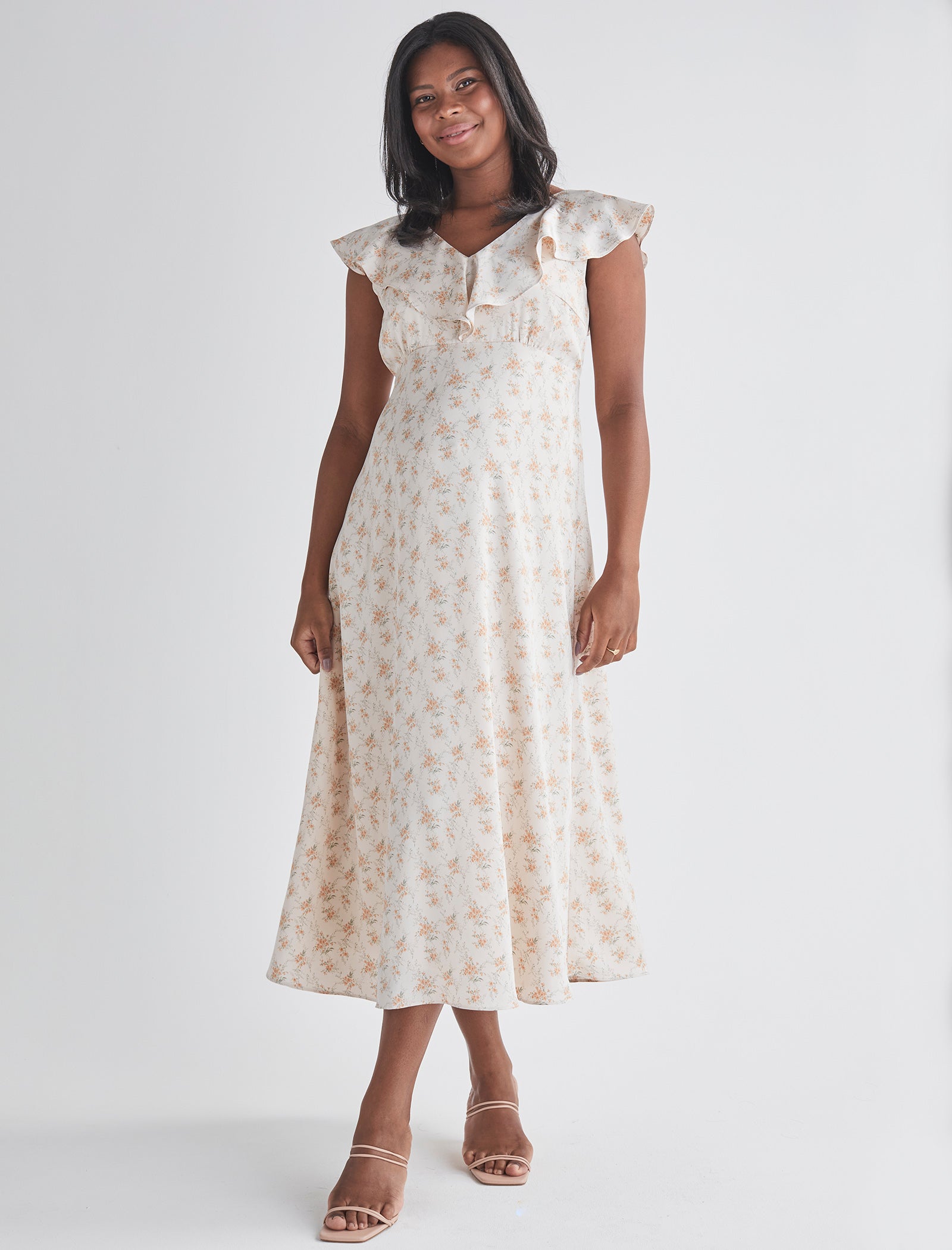 Main view-Delicate ruffle detail at neckline  - Smocked, stretch back for comfort  - Midi length A-line - Lined top fron Angel Maternity