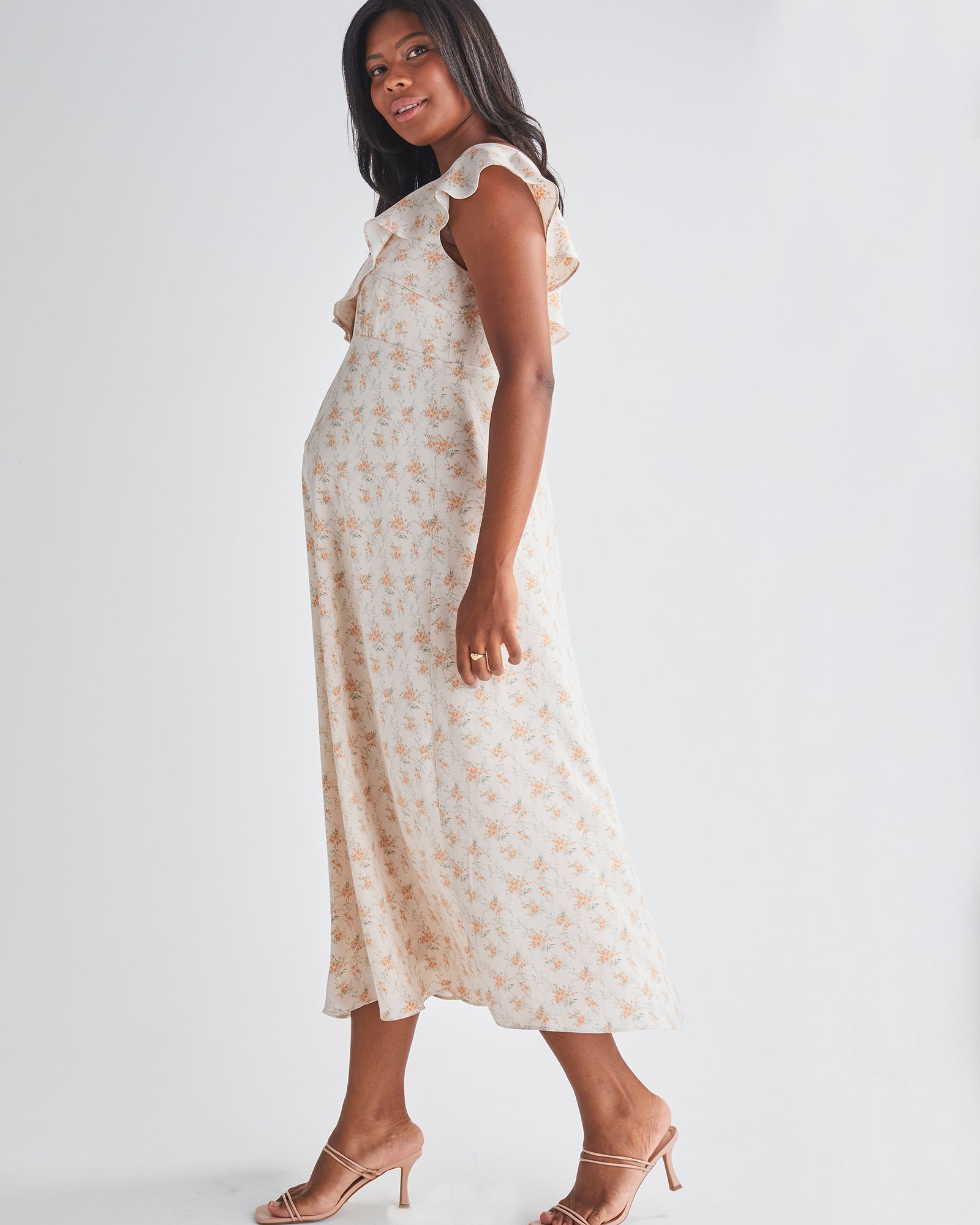 Side view-Delicate ruffle detail at neckline - Smocked, stretch back for comfort - Midi length A-line - Lined top fron Angel Maternity