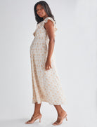 Side view-Delicate ruffle detail at neckline - Smocked, stretch back for comfort - Midi length A-line - Lined top fron Angel Maternity