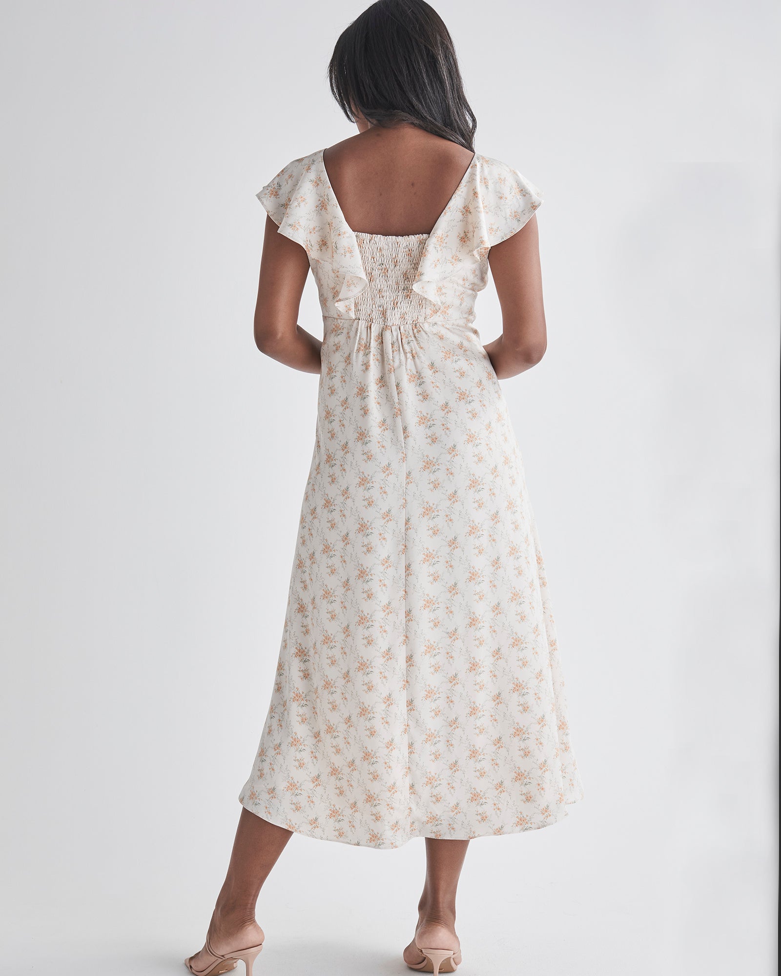 Back view-Delicate ruffle detail at neckline - Smocked, stretch back for comfort - Midi length A-line - Lined top fron Angel Maternity