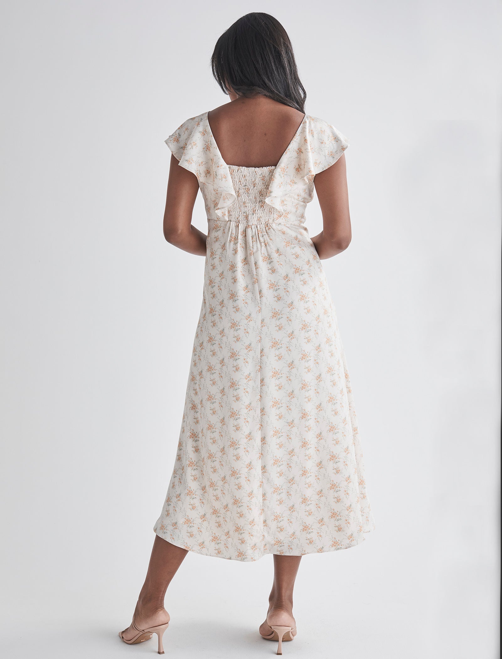 Back view-Delicate ruffle detail at neckline - Smocked, stretch back for comfort - Midi length A-line - Lined top fron Angel Maternity