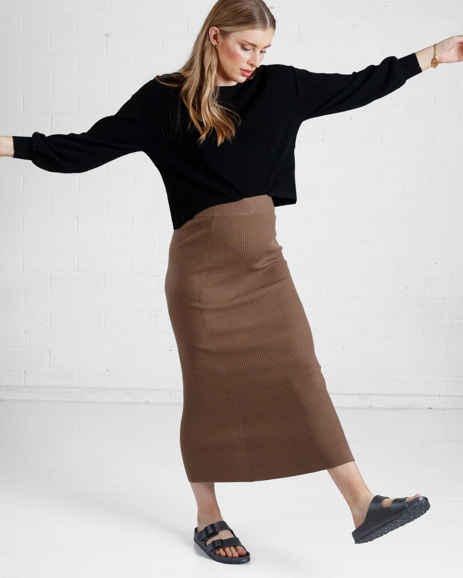 a woman in brown maternity angel maternity wool blend knit skirt with side split, full looks (6651643461735)