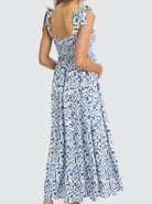 Back View - A pregnant Woman in Nursing Friendly Shoulder Tie Maternity Maxi Dress in Blue Print