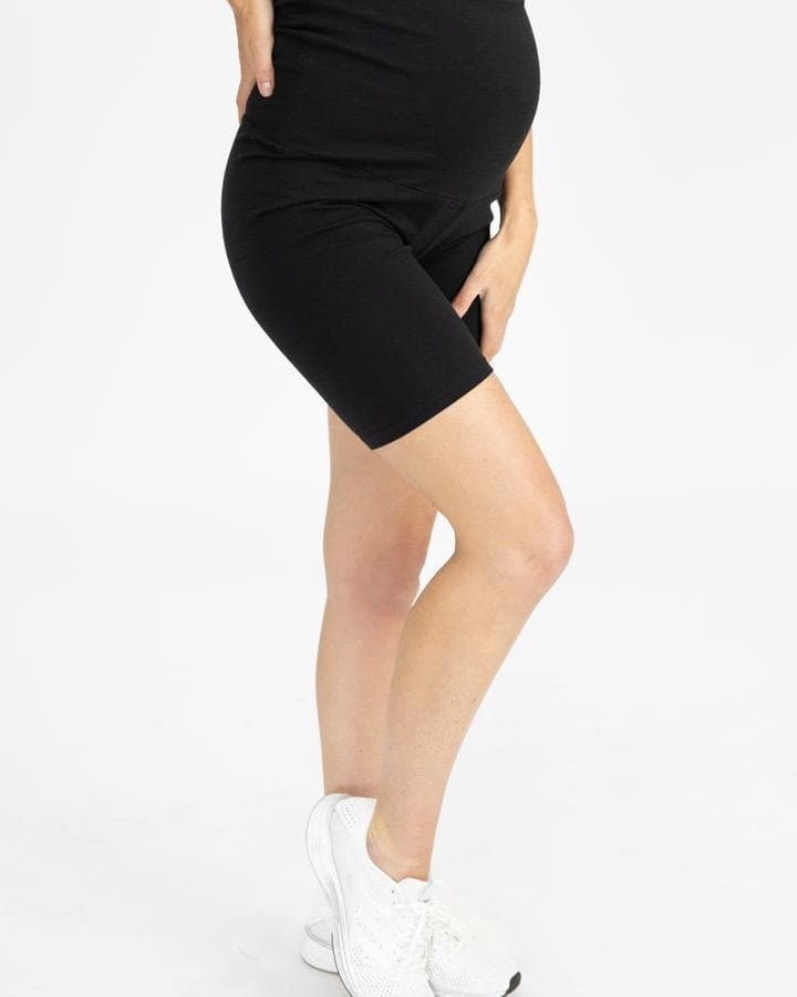 A woman in black maternity bike shorts, side (6535230947431)