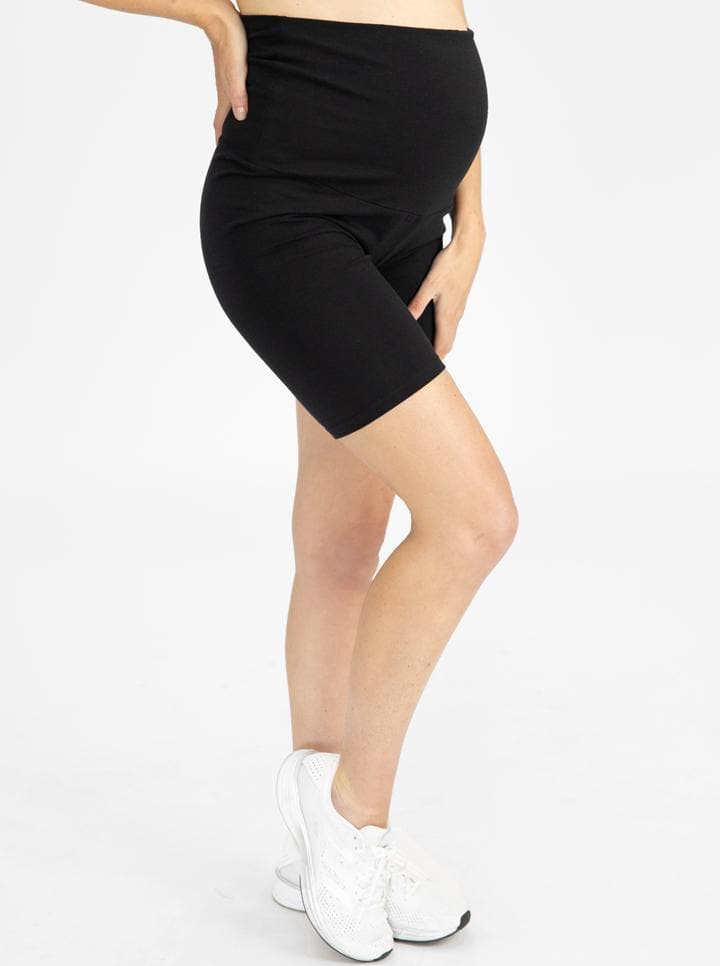 A woman in black maternity bike shorts, side (6535230947431)