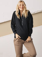 Main View - A Pregnant Woman in Calla Maternity Cotton Sweatpants in Black Color from Angel Maternity (6728286568542)