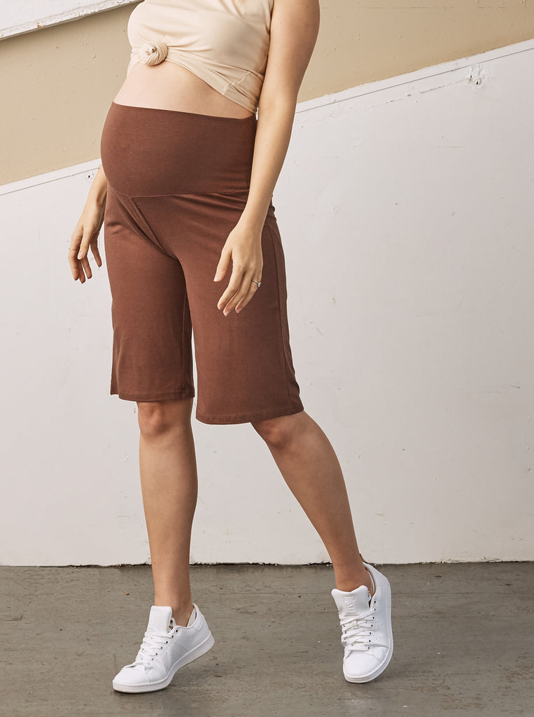 Side view - A Pregnant Woman in Chocolate Brown Wide Leg Knee Length Bamboo Maternity Shorts (6707663011943)