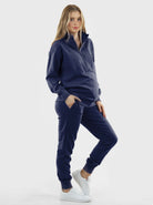 A woman in Calla navy black maternity tracksuit set, front1 (6647093657703)