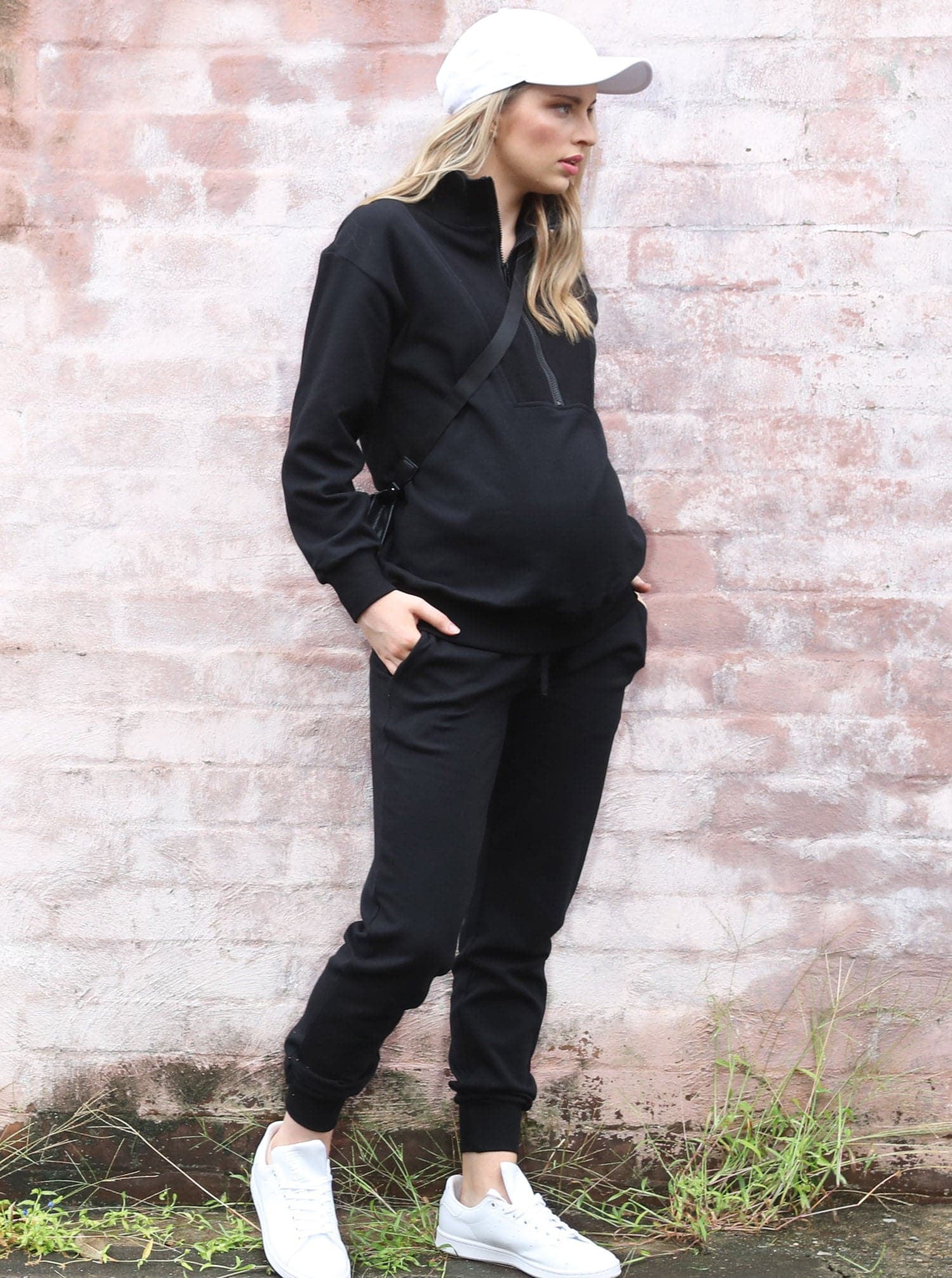 A woman in Calla navy black maternity tracksuit set, side (6647093657703)
